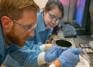 Scientists eric meshot and ngoc bui evaluate the uniformity of a vertically aligned carbon nanotube array.